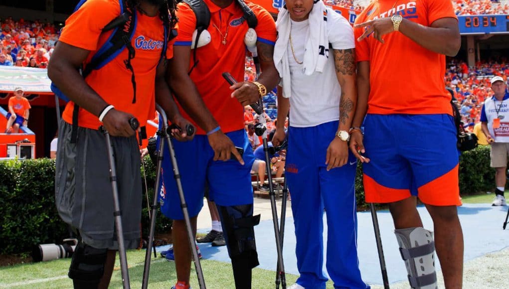 University of Florida players Dre Massey, Antonio Riles, C.J. McWilliams and Quincy Lenton watch the Gators play Kentucky- Florida Gators football- 1280x1280