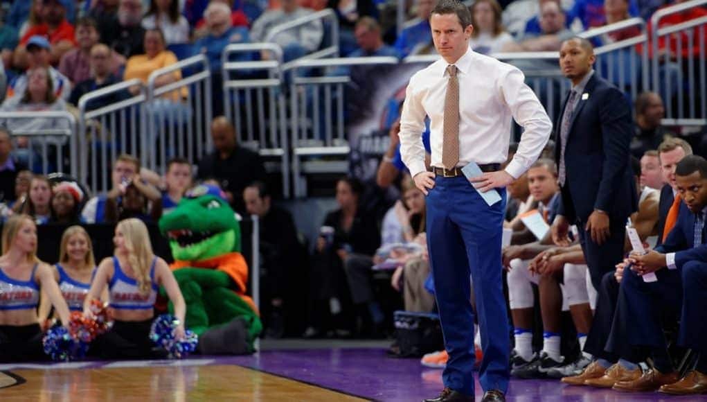 Florida Gators basketball coach Mike White looks on as the Gators play in the NCAA tournament- 1280x853