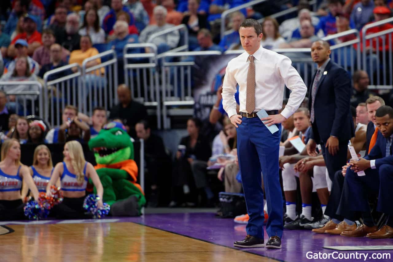 Florida Gators basketball coach Mike White looks on as the Gators play in the NCAA tournament- 1280x853