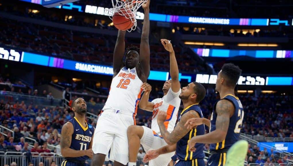 Florida Gators basketball player Gorjok Gak dunks against ETSU- 1280x853