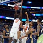 Florida Gators basketball player Gorjok Gak dunks against ETSU- 1280x853