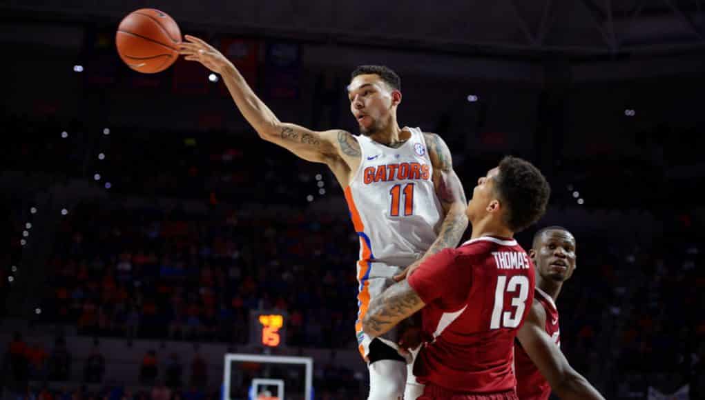 Florida Gators basketball point guard Chris Chiozza passes against Arkansas- 1280x853