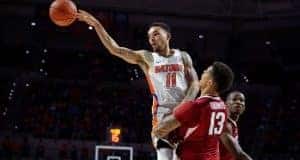 Florida Gators basketball point guard Chris Chiozza passes against Arkansas- 1280x853