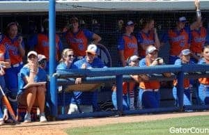 Florida Gators softball team watches on from the dugout- 1280x549