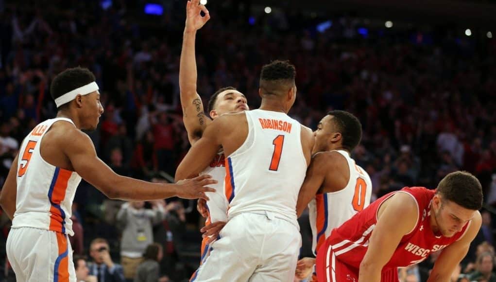 Mar 24, 2017; New York, NY, USA; Florida Gators guard Chris Chiozza (11) celebrates making the game winning shot against the Wisconsin Badgers in the semifinals of the East Regional of the 2017 NCAA Tournament at Madison Square Garden. Mandatory Credit: Brad Penner-USA TODAY Sports