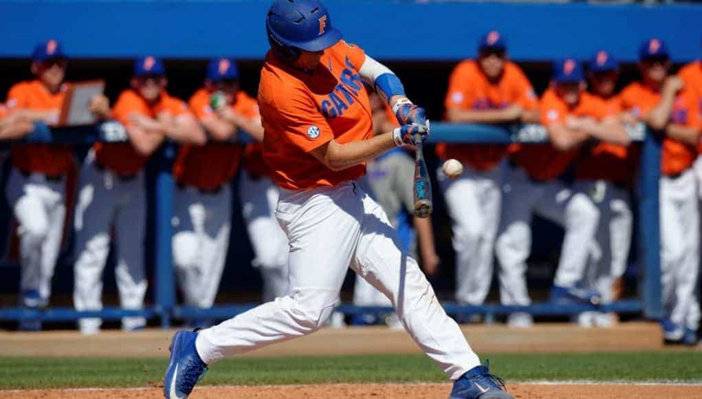 University of Florida catcher JJ Schwarz makes contact with a pitch in a Sunday afternoon win over the Miami Hurricanes- Florida Gators baseball- 1280x852