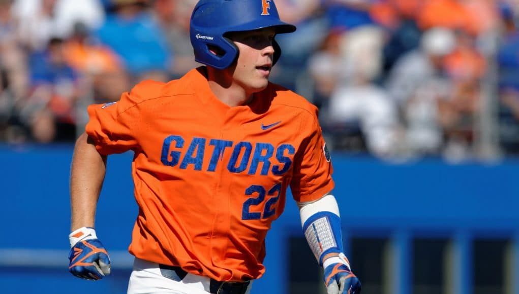 University of Florida catcher JJ Schwarz runs to first base after a single against the Miami Hurricanes- Florida Gators baseball- 1280x852