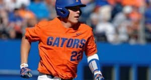 University of Florida catcher JJ Schwarz runs to first base after a single against the Miami Hurricanes- Florida Gators baseball- 1280x852