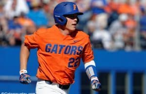 University of Florida catcher JJ Schwarz runs to first base after a single against the Miami Hurricanes- Florida Gators baseball- 1280x852