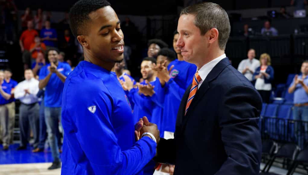 University of Florida head coach Mike White greets Kasey Hill during Senior Night ceremonies- Florida Gators basketball- 1820x854