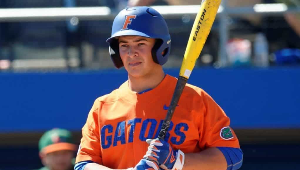University of Florida outfielder Austin Langworthy gets a sign before stepping into the box against Miami- Florida Gators baseball- 1280x942