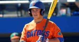 University of Florida outfielder Austin Langworthy gets a sign before stepping into the box against Miami- Florida Gators baseball- 1280x942