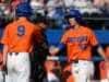 University of Florida senior Ryan Larson celebrates with Christian Hicks after scoring to give UF a 5-2 lead over Miami- Florida Gators baseball- 1280x852