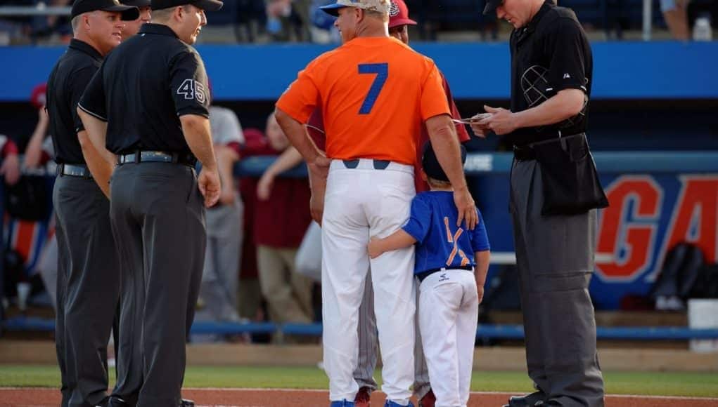 University of Florida head baseball coach Kevin O’Sullivan and his son Finn deliver the starting lineups to the umpire- Florida Gators baseball- 1280x852