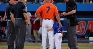 University of Florida head baseball coach Kevin O’Sullivan and his son Finn deliver the starting lineups to the umpire- Florida Gators baseball- 1280x852