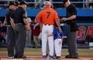 University of Florida head baseball coach Kevin O’Sullivan and his son Finn deliver the starting lineups to the umpire- Florida Gators baseball- 1280x852