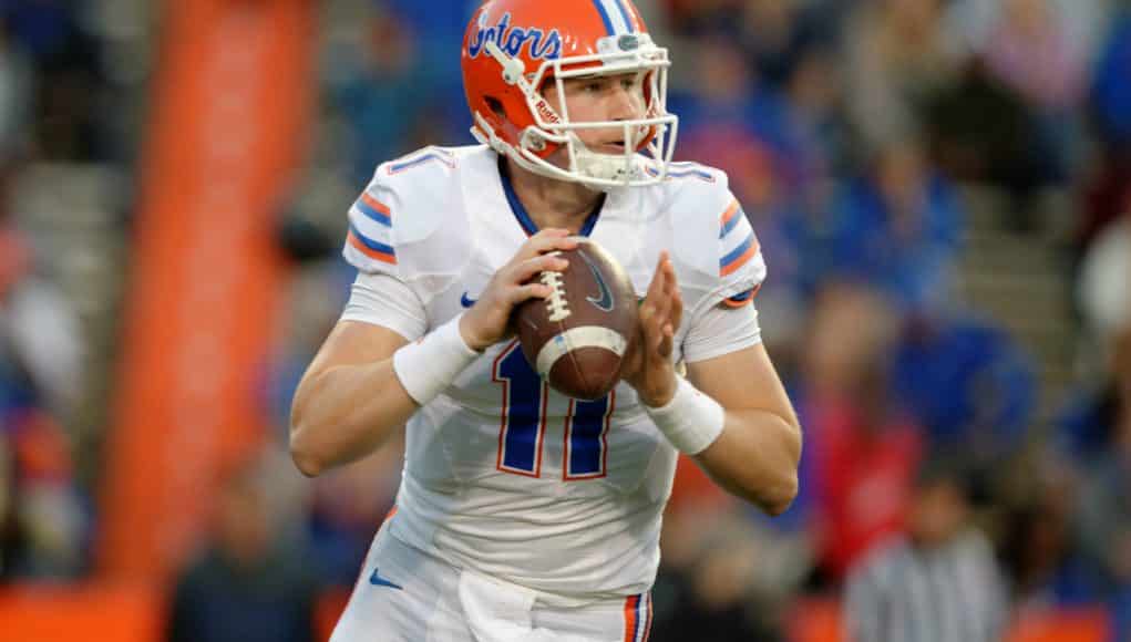 University of Florida quarterback Kyle Trask rolls out before throwing a pass in the Orange and Blue Debut- Florida Gators football- 1280x852