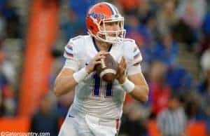 University of Florida quarterback Kyle Trask rolls out before throwing a pass in the Orange and Blue Debut- Florida Gators football- 1280x852