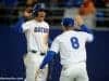 University of Florida infielders Jonathan India (6) and Deacon Liput (8) celebrate after India scored a run against Florida State- Florida Gators baseball- 1280x852