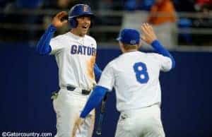 University of Florida infielders Jonathan India (6) and Deacon Liput (8) celebrate after India scored a run against Florida State- Florida Gators baseball- 1280x852