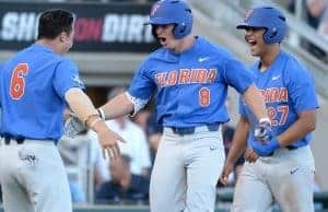 Jun 20, 2017; Omaha, NE, USA; Florida Gators infielder Deacon Liput (8) celebrates with infielder Jonathan India (6) and infielder Nelson Maldonado (27) after hitting a three run home run in the fourth inning against the Louisville Cardinals at TD Ameritrade Park Omaha. Mandatory Credit: Steven Branscombe-USA TODAY Sports