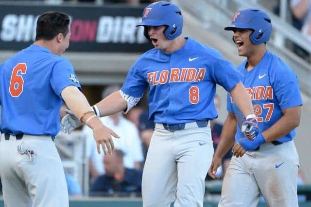 USATSI_10122632 Jun 20, 2017; Omaha, NE, USA; Florida Gators infielder Deacon Liput (8) celebrates with infielder Jonathan India (6) and infielder Nelson Maldonado (27) after hitting a three run home run in the fourth inning against the Louisville Cardinals at TD Ameritrade Park Omaha. Mandatory Credit: Steven Branscombe-USA TODAY Sports