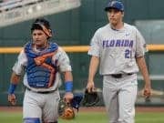 Jun 24, 2017; Omaha, NE, USA; Florida Gators pitcher Alex Faedo (21) and catcher Mike Rivera (4) walk to the dugout before the game against the TCU Horned Frogs at TD Ameritrade Park Omaha. Mandatory Credit: Steven Branscombe-USA TODAY Sports
