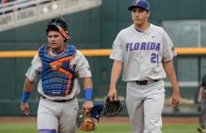 Jun 24, 2017; Omaha, NE, USA; Florida Gators pitcher Alex Faedo (21) and catcher Mike Rivera (4) walk to the dugout before the game against the TCU Horned Frogs at TD Ameritrade Park Omaha. Mandatory Credit: Steven Branscombe-USA TODAY Sports