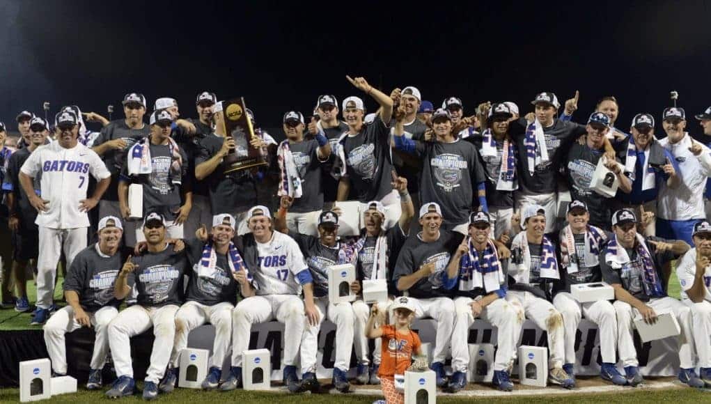 Jun 27, 2017; Omaha, NE, USA; Florida Gators players and coaches celebrate with the national championship trophy after the game against the LSU Tigers in game two of the championship series of the 2017 College World Series at TD Ameritrade Park Omaha. Mandatory Credit: Steven Branscombe-USA TODAY Sports