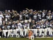 Jun 27, 2017; Omaha, NE, USA; Florida Gators players and coaches celebrate with the national championship trophy after the game against the LSU Tigers in game two of the championship series of the 2017 College World Series at TD Ameritrade Park Omaha. Mandatory Credit: Steven Branscombe-USA TODAY Sports