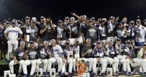 Jun 27, 2017; Omaha, NE, USA; Florida Gators players and coaches celebrate with the national championship trophy after the game against the LSU Tigers in game two of the championship series of the 2017 College World Series at TD Ameritrade Park Omaha. Mandatory Credit: Steven Branscombe-USA TODAY Sports