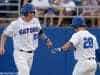 University of Florida catcher JJ Schwarz celebrates with Mark Kolozsvary after scoring a run against Kentucky- Florida Gators baseball- 1280x852