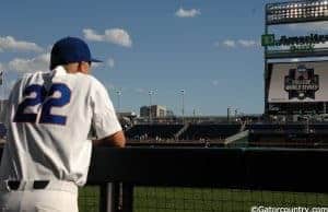 University of Florida catcher JJ Schwarz watches TCU take infield before the Gators and Frogs play in the College World Series- Florida Gators baseball- 1280x850