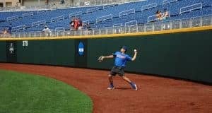 University of Florida outfielder/pitcher Nick Horvath throws a ball into the infield during practice in Omaha- Florida Gators baseball- 1280x850