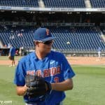 University of Florida pitcher Garrett Milchin warms up before the Florida Gators CWS game against the Louisville Cardinals- Florida Gators baseball- 1280x850