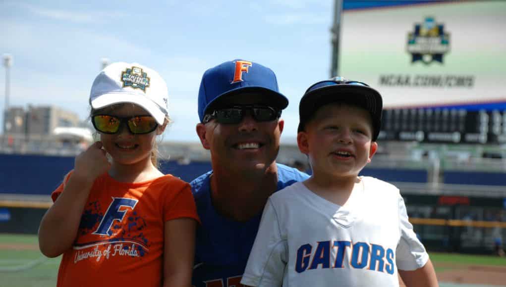 University of Florida head coach Kevin O’Sullivan poses with his kids, Payton and Finn, in Omaha at the College World Series- Florida Gators baseball- 1280x850