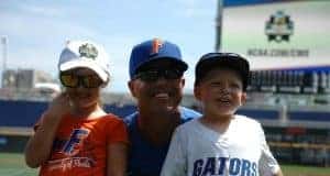 University of Florida head coach Kevin O’Sullivan poses with his kids, Payton and Finn, in Omaha at the College World Series- Florida Gators baseball- 1280x850