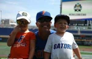 University of Florida head coach Kevin O’Sullivan poses with his kids, Payton and Finn, in Omaha at the College World Series- Florida Gators baseball- 1280x850