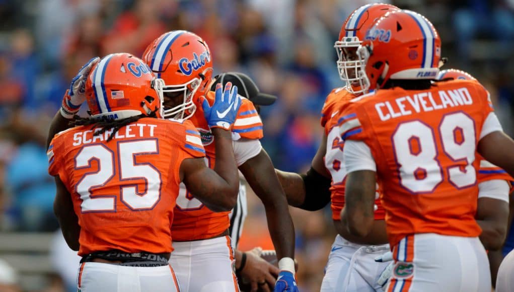 University of Florida running back Jordan Scarlett celebrates with C’yontai Lewis after scoring a touchdown in the 2017 Orange and Blue Debut- Florida Gators football- 1280x852