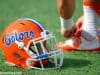 A Florida Gators helmet rests on the field as the Gators get ready to take on Michigan before the 2016 Buffalo Wild Wings Bowl- Florida Gators football- 1280x852