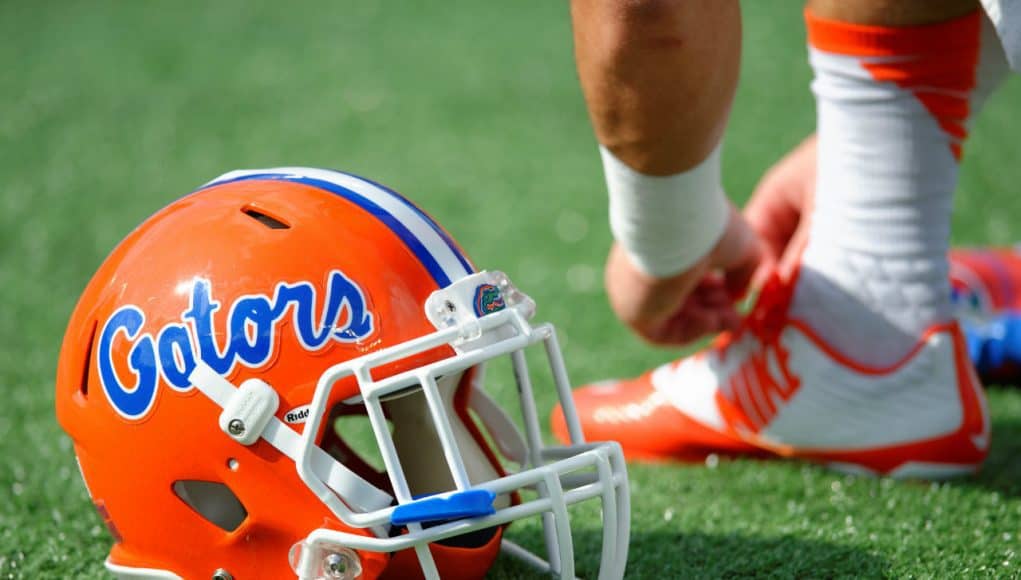 A Florida Gators helmet rests on the field as the Gators get ready to take on Michigan before the 2016 Buffalo Wild Wings Bowl- Florida Gators football- 1280x852