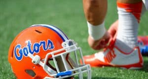 A Florida Gators helmet rests on the field as the Gators get ready to take on Michigan before the 2016 Buffalo Wild Wings Bowl- Florida Gators football- 1280x852