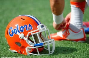 A Florida Gators helmet rests on the field as the Gators get ready to take on Michigan before the 2016 Buffalo Wild Wings Bowl- Florida Gators football- 1280x852