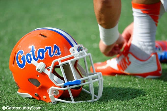 A Florida Gators helmet rests on the field as the Gators get ready to take on Michigan before the 2016 Buffalo Wild Wings Bowl- Florida Gators football- 1280x852