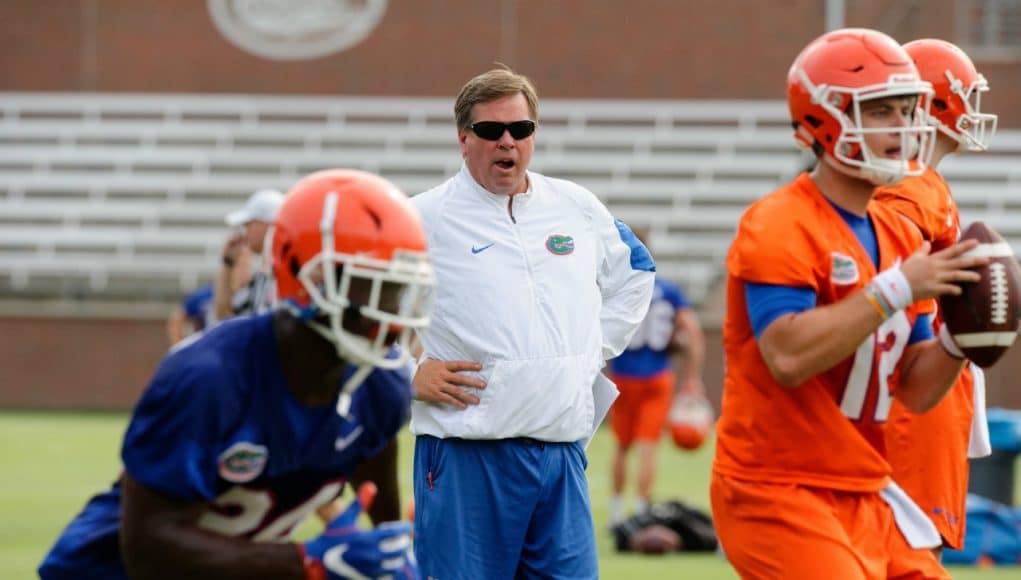 University of Florida head coach Jim McElwain watches as Jake Allen goes through a rep during 2017 fall camp- Florida Gators football- 1280x852