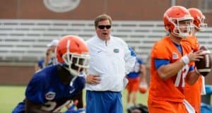 University of Florida head coach Jim McElwain watches as Jake Allen goes through a rep during 2017 fall camp- Florida Gators football- 1280x852