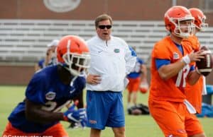 University of Florida head coach Jim McElwain watches as Jake Allen goes through a rep during 2017 fall camp- Florida Gators football- 1280x852