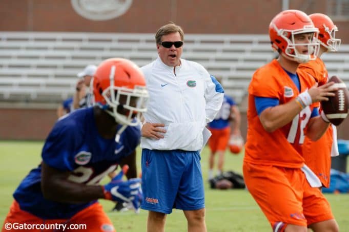 University of Florida head coach Jim McElwain watches as Jake Allen goes through a rep during 2017 fall camp- Florida Gators football- 1280x852