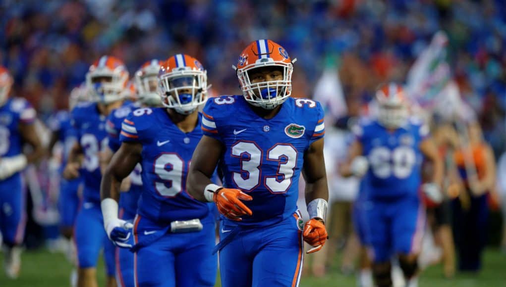 University of Florida linebacker David Reese runs onto Florida Field before the Gators game against Michigan- Florida Gators football- 1280x852