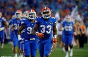 University of Florida linebacker David Reese runs onto Florida Field before the Gators game against Michigan- Florida Gators football- 1280x852